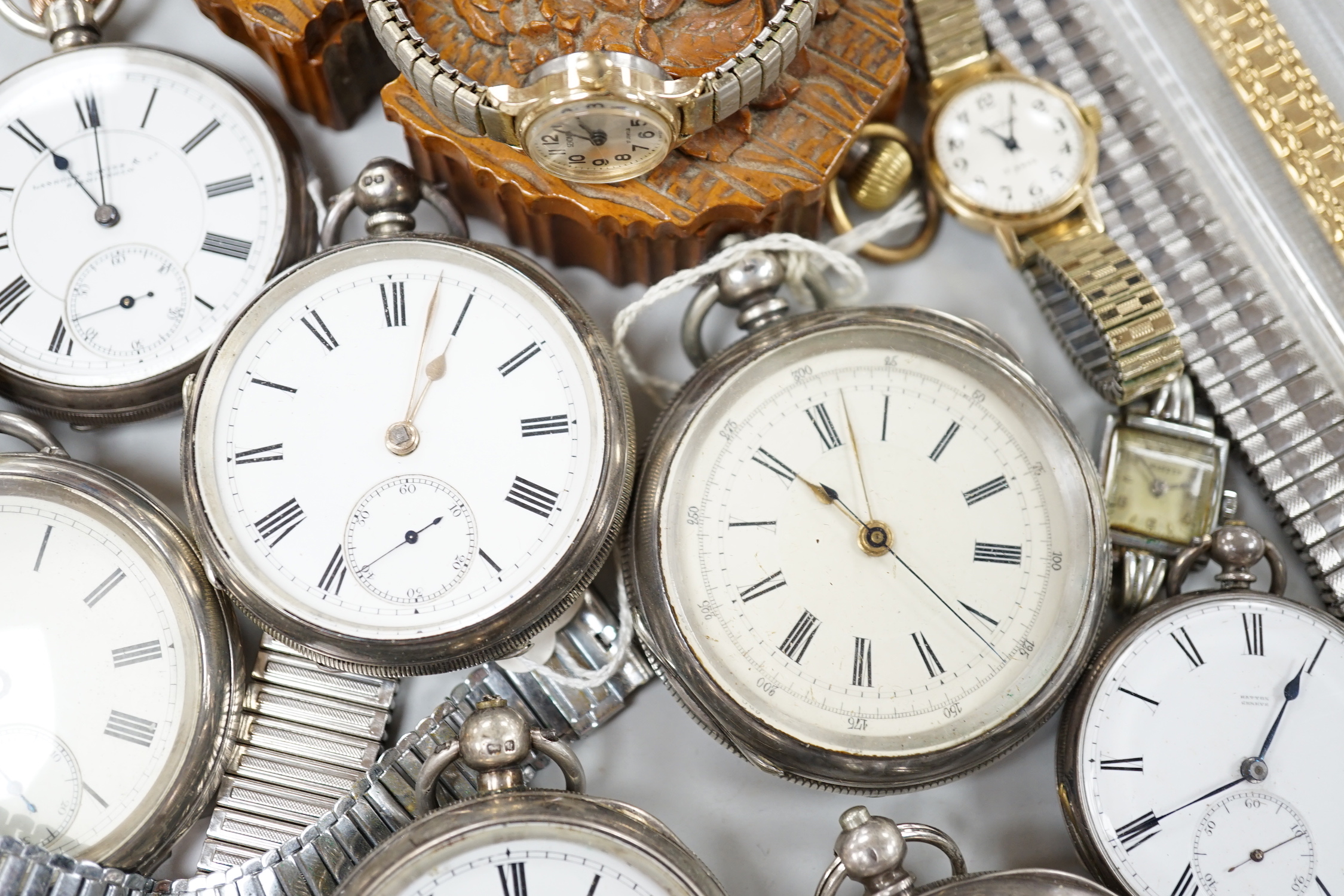 Twenty one assorted silver or base metal pocket watches including Waltham and Child of Birmingham, three wrist watches and a silver vesta case.